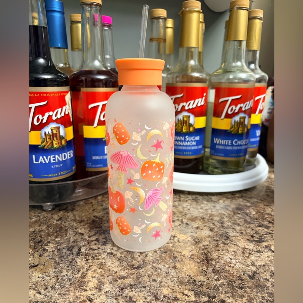 Glass frosted water bottle with mushrooms and pumpkins and moons